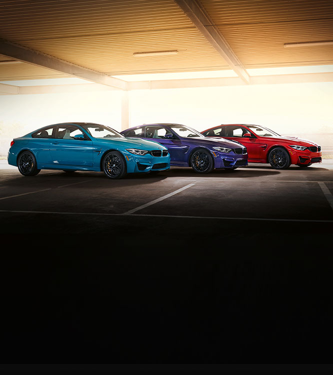 The BMW M4 Edition M Heritage family in Laguna Seca Blue, Velvet Blue, and Imola Red II.