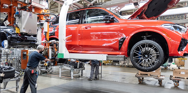 A BMW being customized by certified BMW professionals at a plant