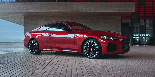 Side profile of a BMW parked in a modern garage