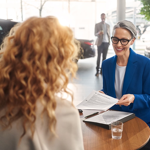 A new BMW owner working with a dealership to finalize a purchase