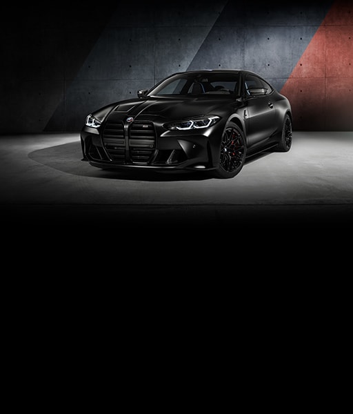 The BMW M4 Kith driving down an open road