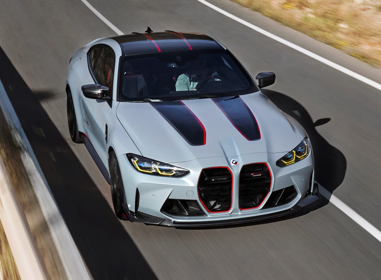 Aerial front shot of the Limited Edition M4 CSL Coupe accelerating on a road, showing off motorsport inspired CSL-specific design