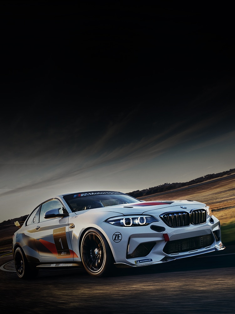 The BMW M2 CS Racing takes a fast corner on the track