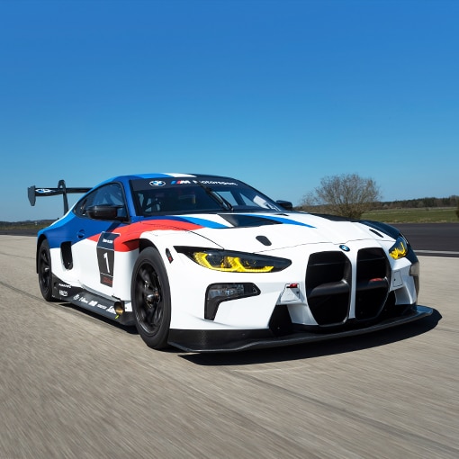 A BMW M4 GT3 accelerating down a straightaway