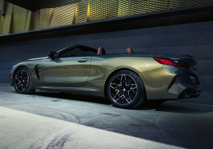 Profile shot of the 2025 BMW M8 Competition Convertible in BMW Individual Brass Metallic