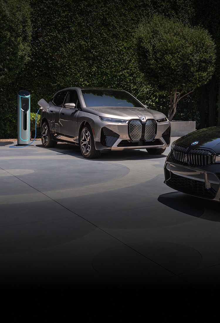 A BMW Certified iX SUV and 3 Series Sedan parked side by side on pavement